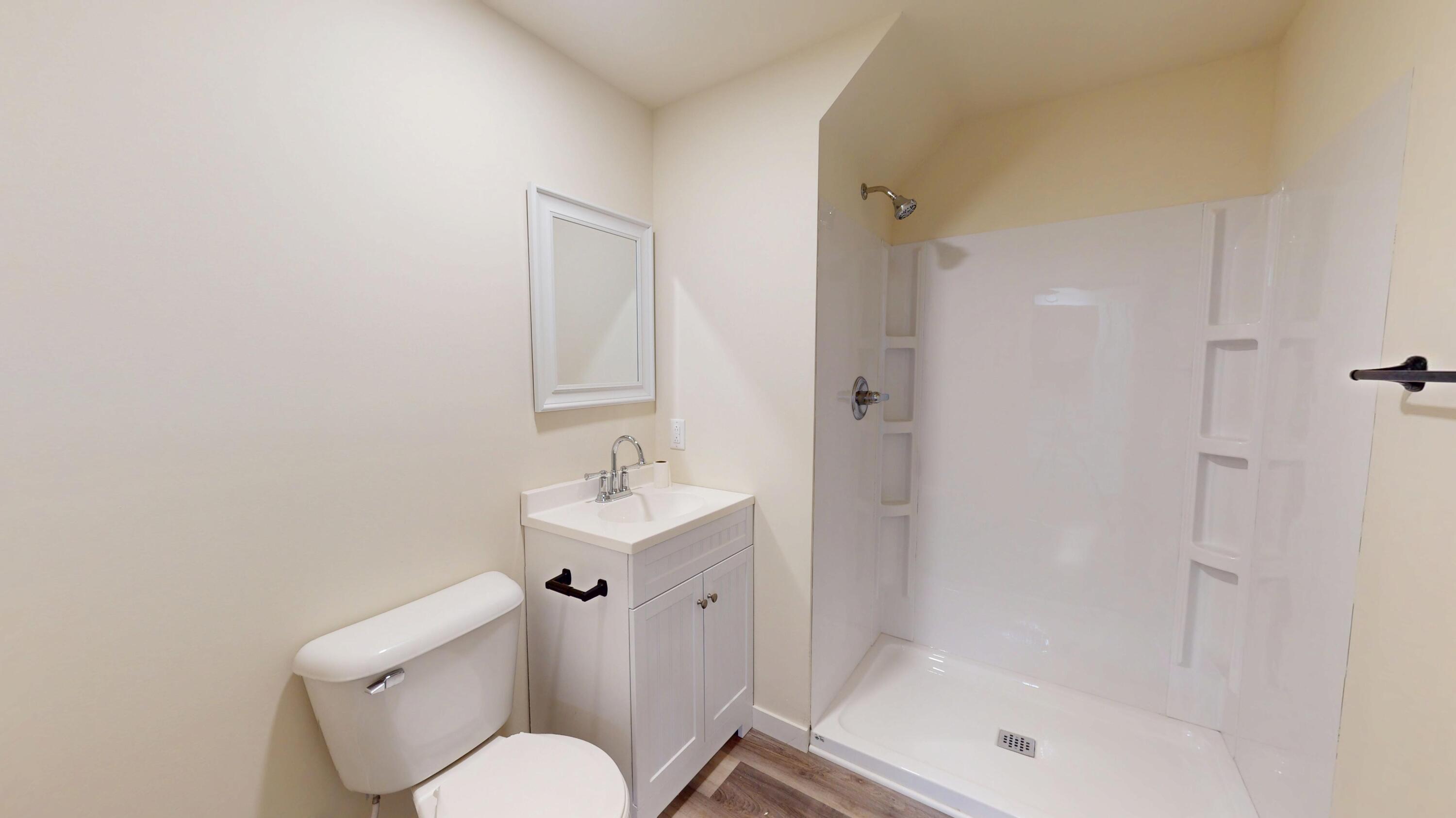 317 Redpath Avenue Michigan City, IN 46360 - Photo 22 of 40 a bathroom with a shower a toilet and a sink