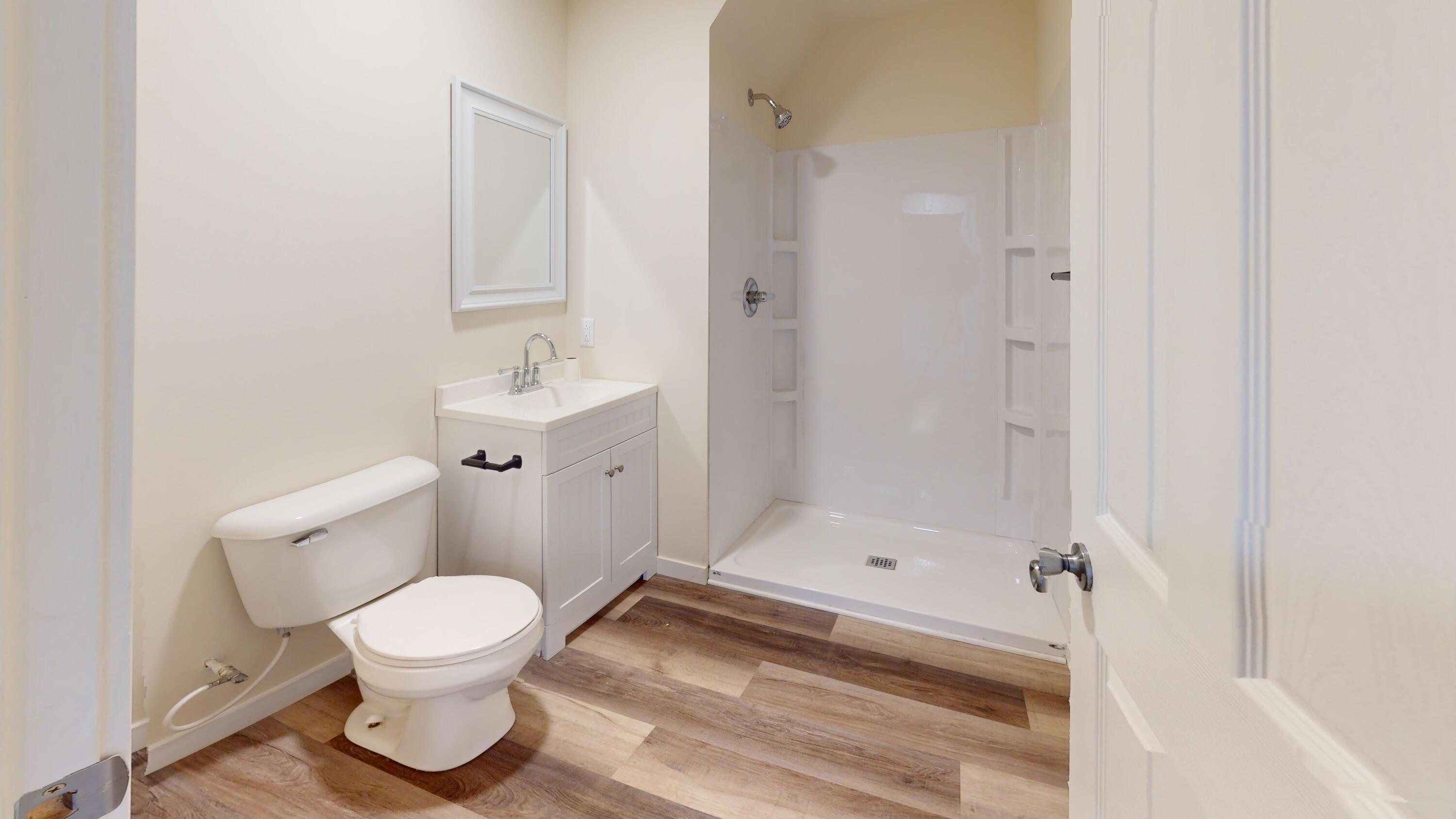 317 Redpath Avenue Michigan City, IN 46360 - Photo 23 of 40 a bathroom with a toilet and a shower