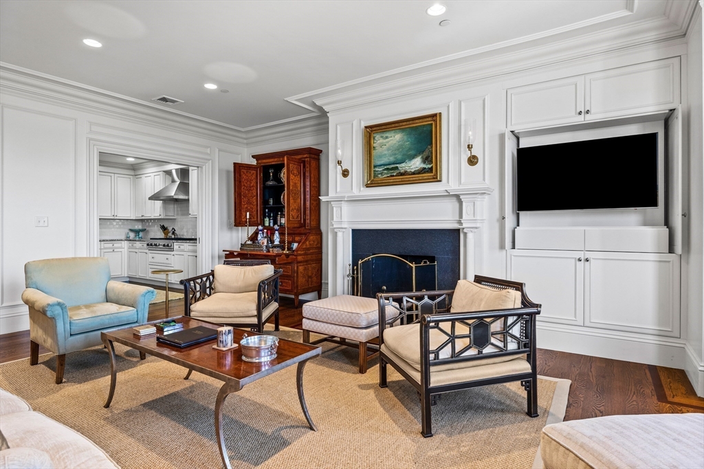 348 Beacon Street, Unit 4 Boston, MA 02116 - Photo 11 of 35 a living room with furniture a flat screen tv and a fireplace