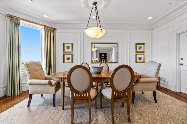 a kitchen with granite countertop white cabinets and white stainless steel appliances