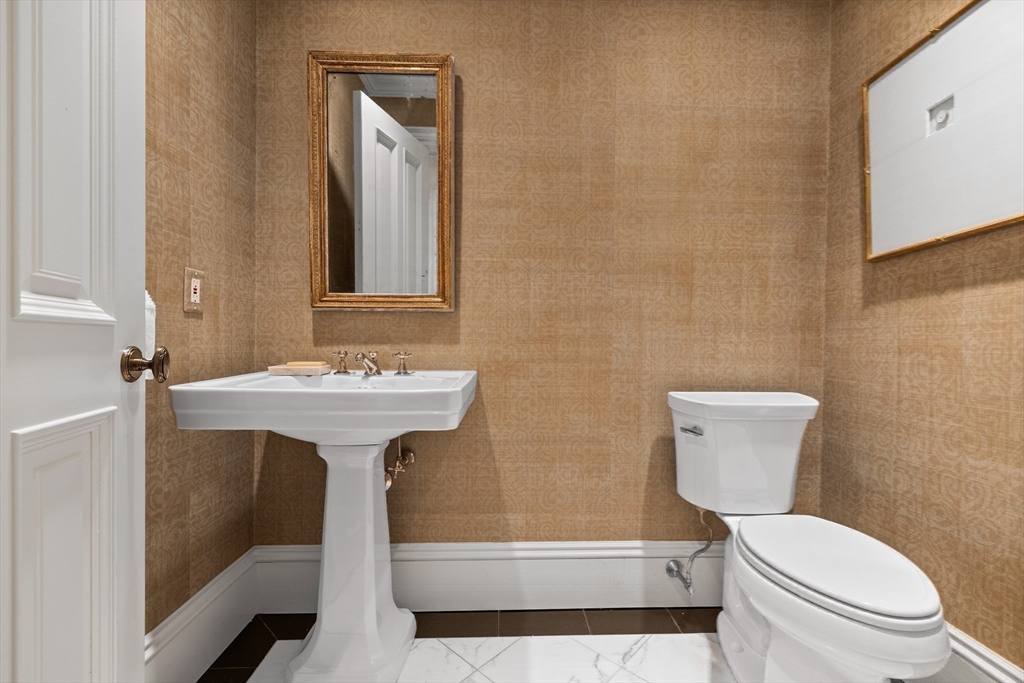 348 Beacon Street, Unit 4 Boston, MA 02116 - Photo 18 of 35 a white toilet sitting next to a bathroom sink