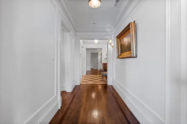 a view of gallery with wooden floor