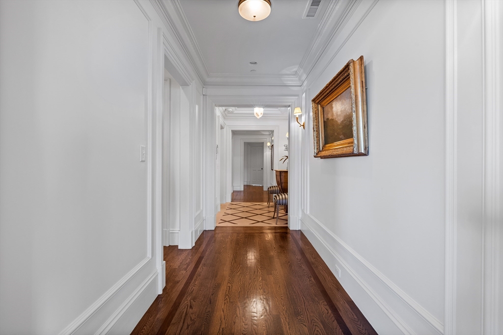 348 Beacon Street, Unit 4 Boston, MA 02116 - Photo 19 of 35 a view of a hallway with wooden floor and staircase