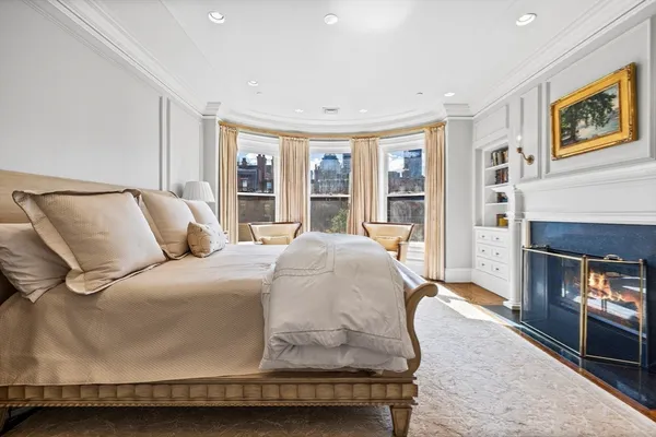 a bedroom with bed and a window