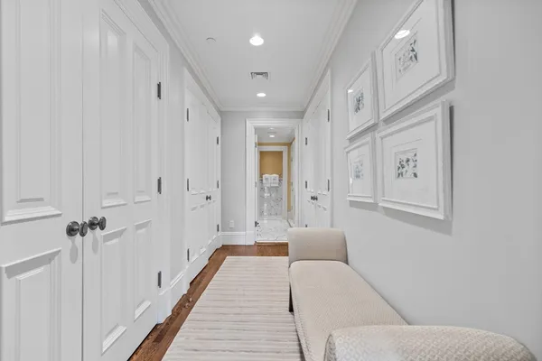 a spacious bathroom with a glass shower door and a bathtub