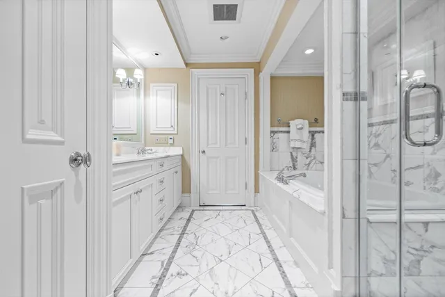 a bathroom with a bathtub and a shower