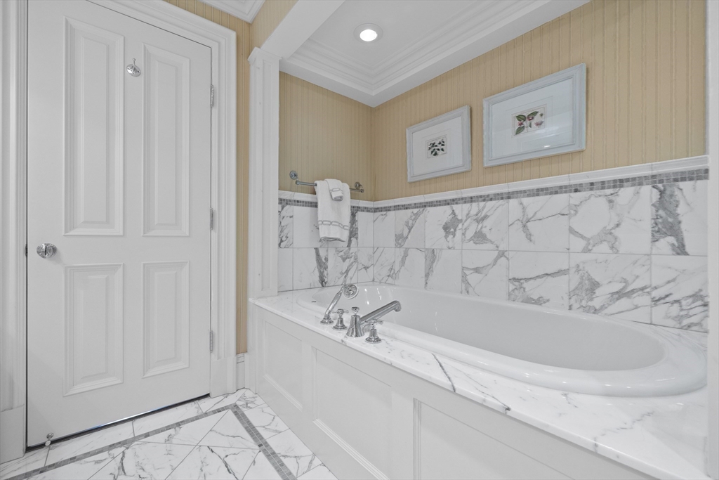 348 Beacon Street, Unit 4 Boston, MA 02116 - Photo 25 of 35 a bathroom with a bathtub and a shower