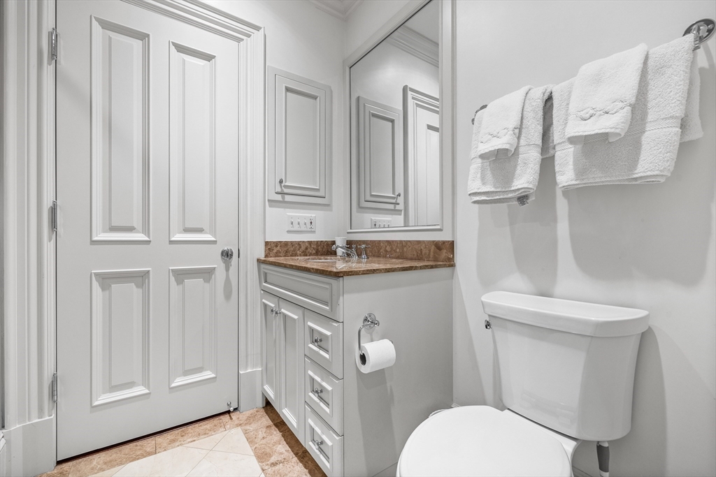 348 Beacon Street, Unit 4 Boston, MA 02116 - Photo 29 of 35 a bathroom with a sink a toilet and shower