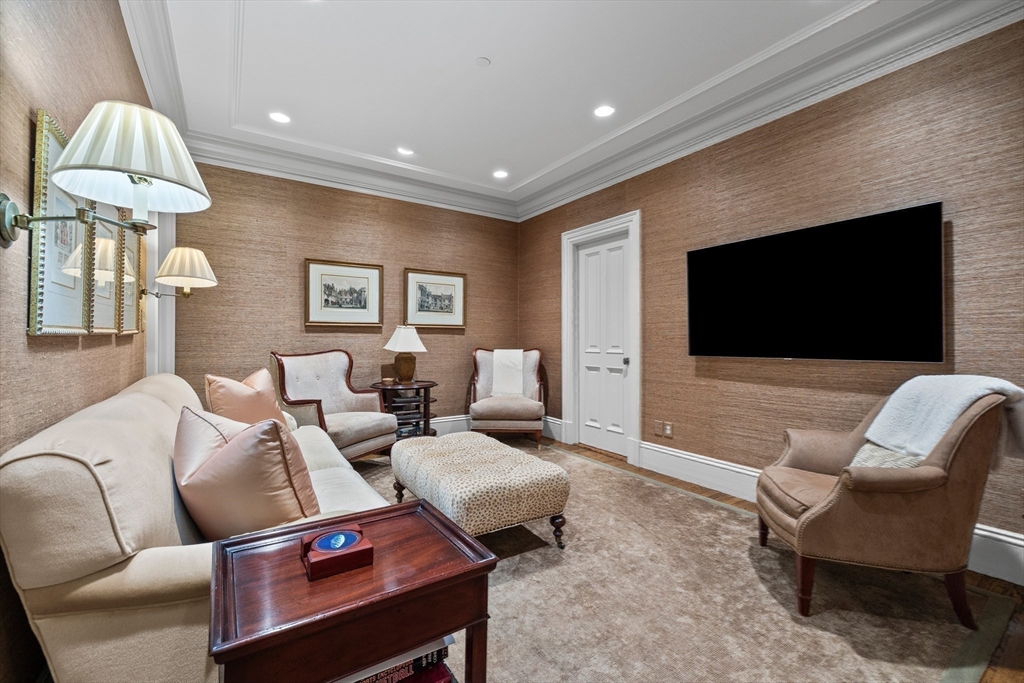 348 Beacon Street, Unit 4 Boston, MA 02116 - Photo 30 of 35 a living room with furniture wooden floor and a flat screen tv