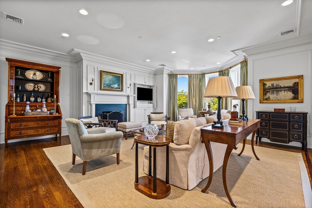 348 Beacon Street, Unit 4 Boston, MA 02116 - Photo 9 of 35 a living room with fireplace furniture and a wooden floor