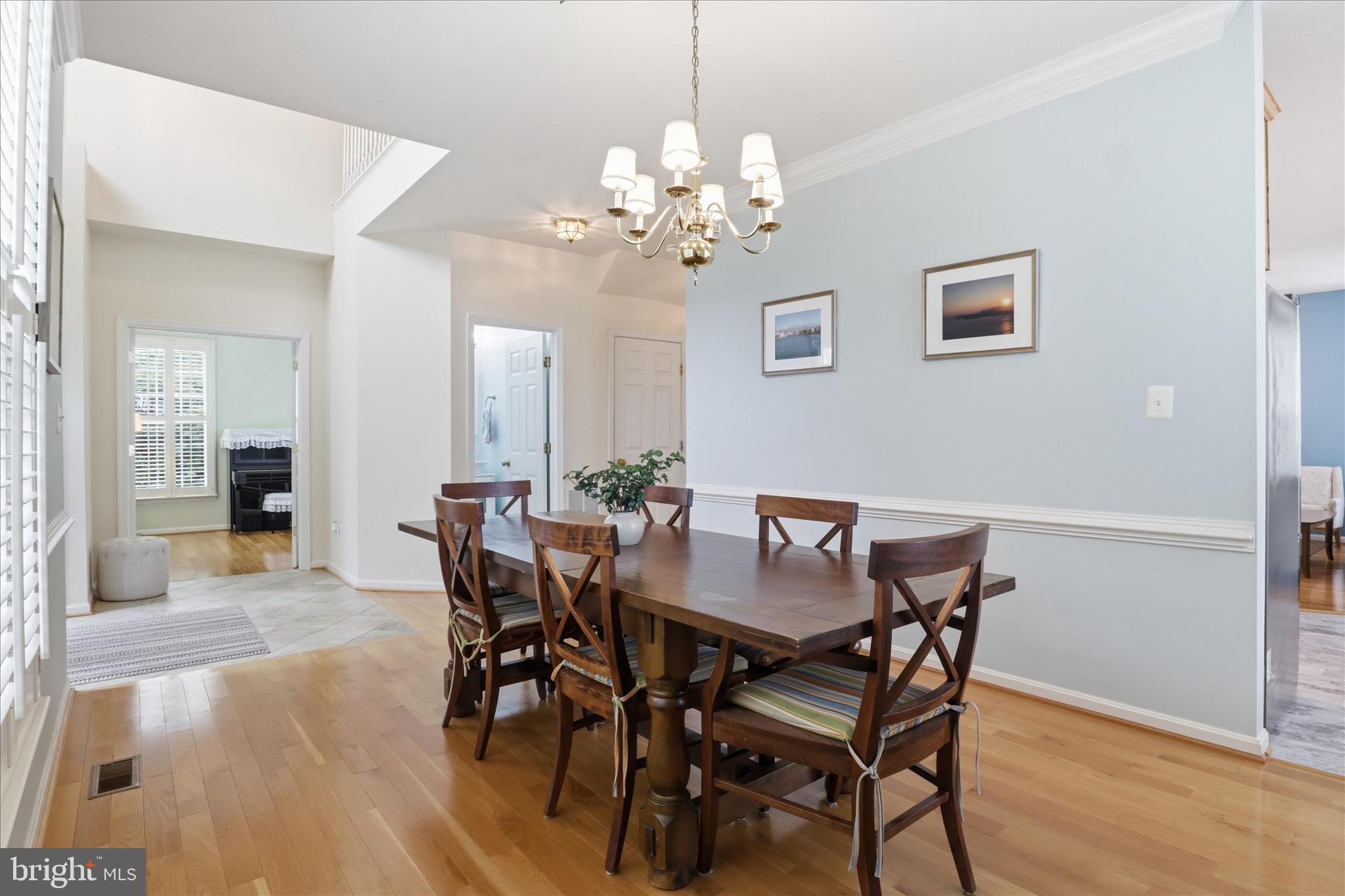 25352 Ripleys Field Drive Chantilly, VA 20152 - Photo 10 of 54 a view of a dining room with furniture and wooden floor