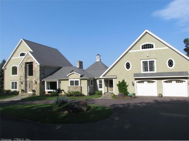 12 Stonefield Road Avon, CT 06001 - Photo 1 of 1 a front view of a house with a yard
