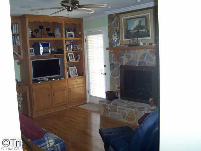 3280 South Friendship Road Germanton, NC 27019 - Photo 4 of 9 Other. Great Den w/hardwood floors,rock fireplace,built in Ent. Ctr,Door leading to deck