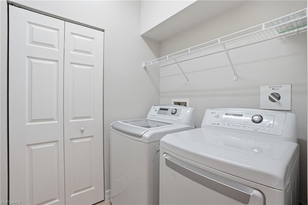 6525 Monterey Point, Unit 101 Naples, FL 34105 - Photo 15 of 18 Laundry room with washer and dryer