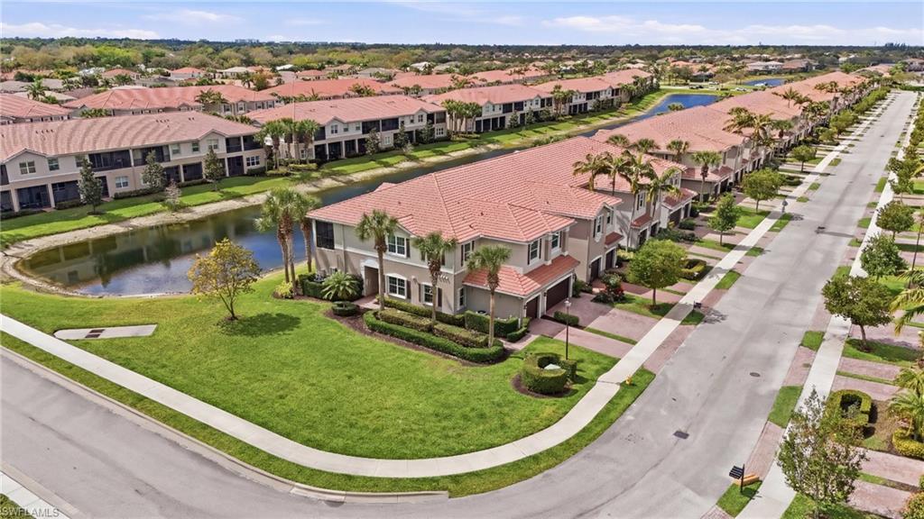 6525 Monterey Point, Unit 101 Naples, FL 34105 - Photo 2 of 18 Aerial views...spacious side greenspace along residence.