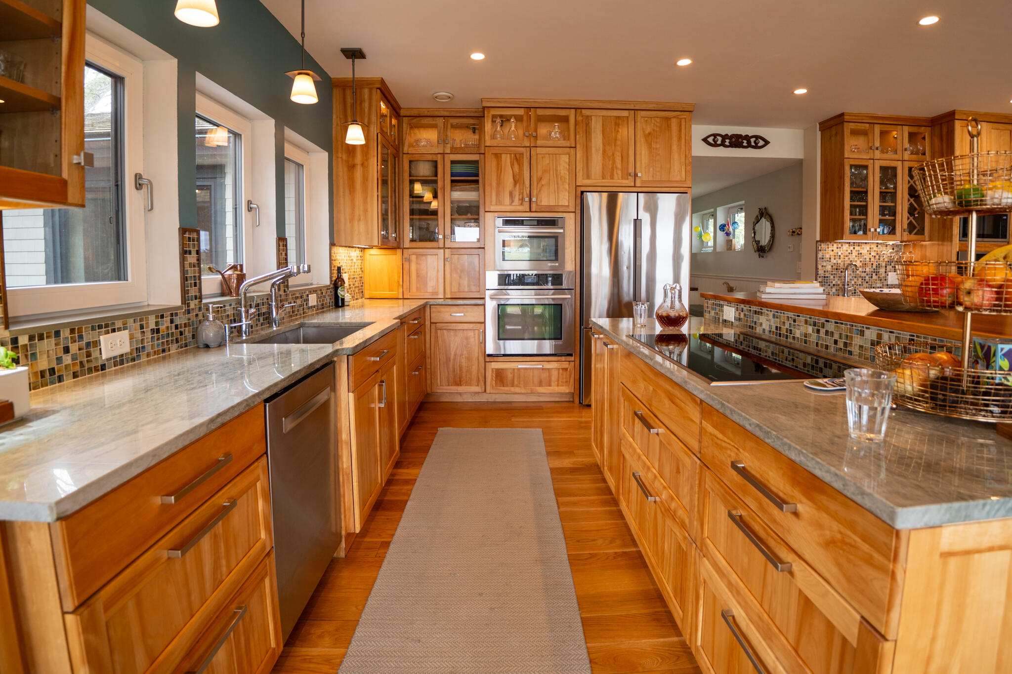39 Sengekontacket Road Oak Bluffs, MA 02557 - Photo 13 of 32 a large kitchen with stainless steel appliances kitchen island granite countertop a large counter top stainless steel appliances and cabinets