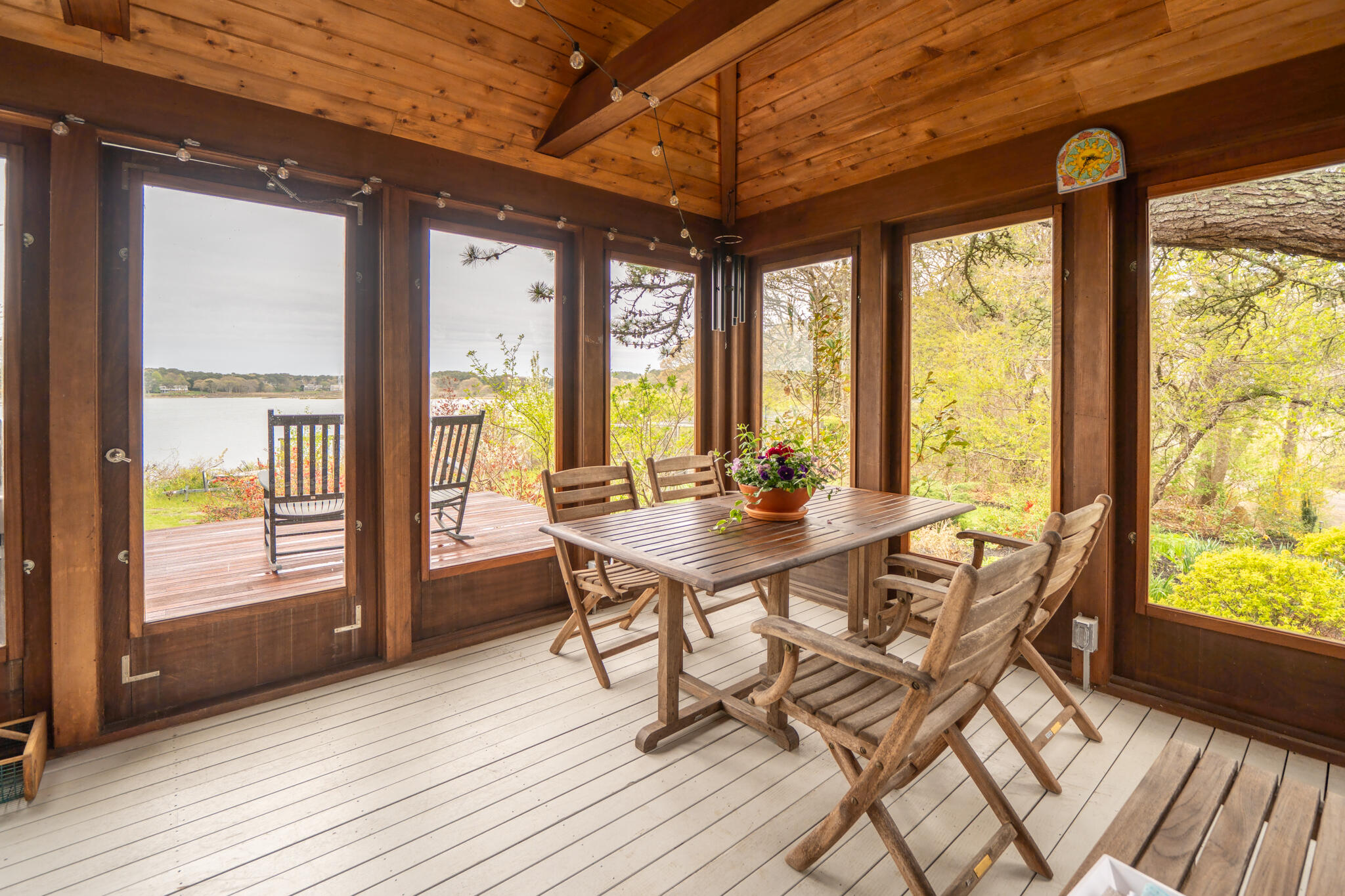 39 Sengekontacket Road Oak Bluffs, MA 02557 - Photo 15 of 32 a view of a dining room with furniture and wooden floor
