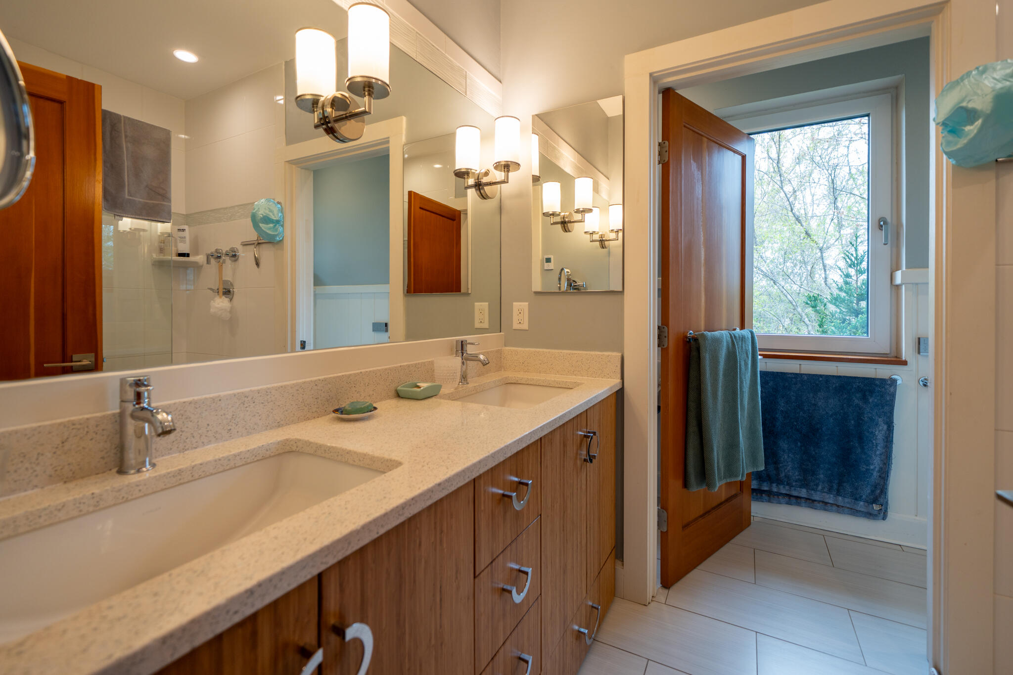 39 Sengekontacket Road Oak Bluffs, MA 02557 - Photo 17 of 32 a bathroom with a double vanity sink a mirror and a shower