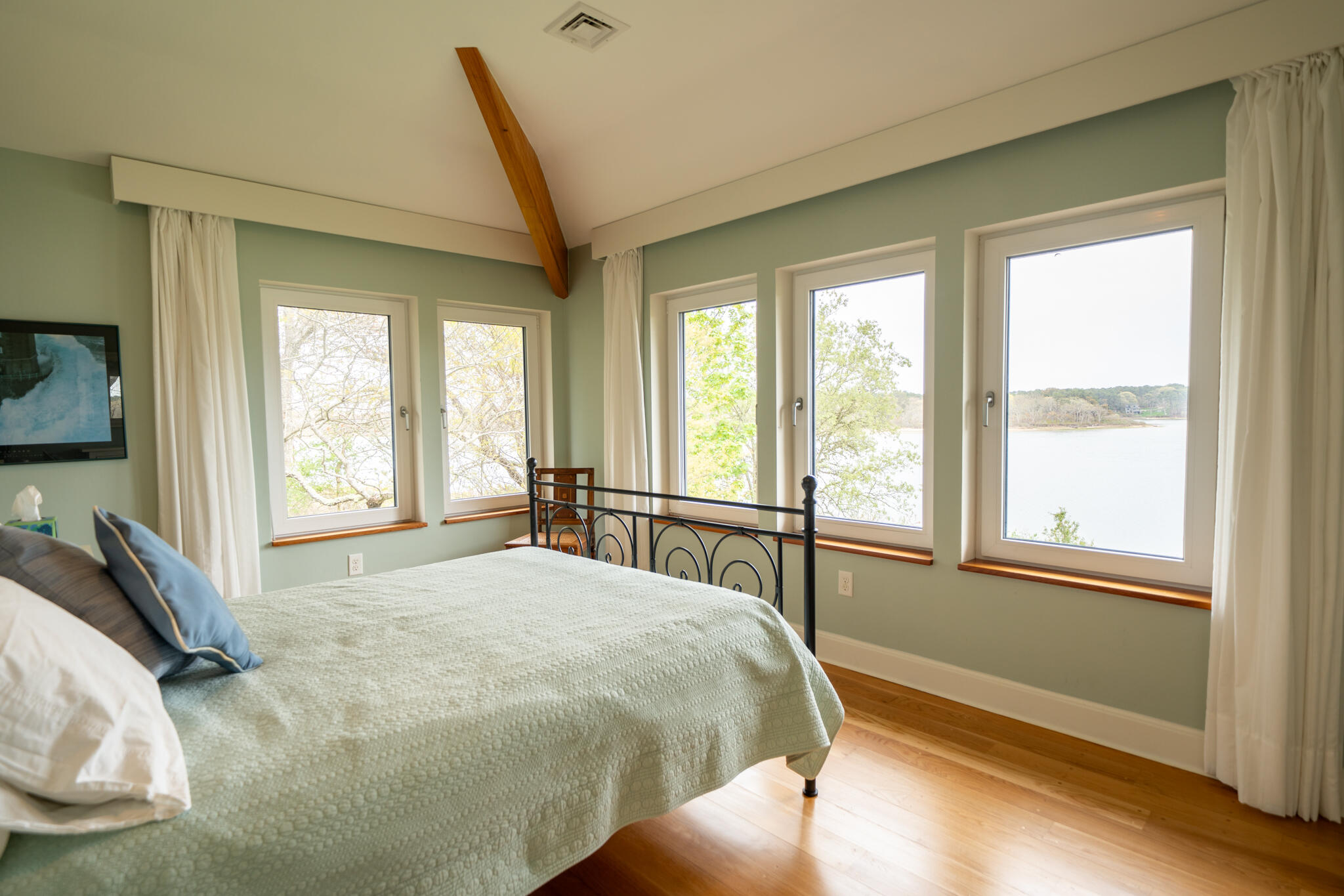 39 Sengekontacket Road Oak Bluffs, MA 02557 - Photo 19 of 32 a bed sitting in a bedroom next to a window
