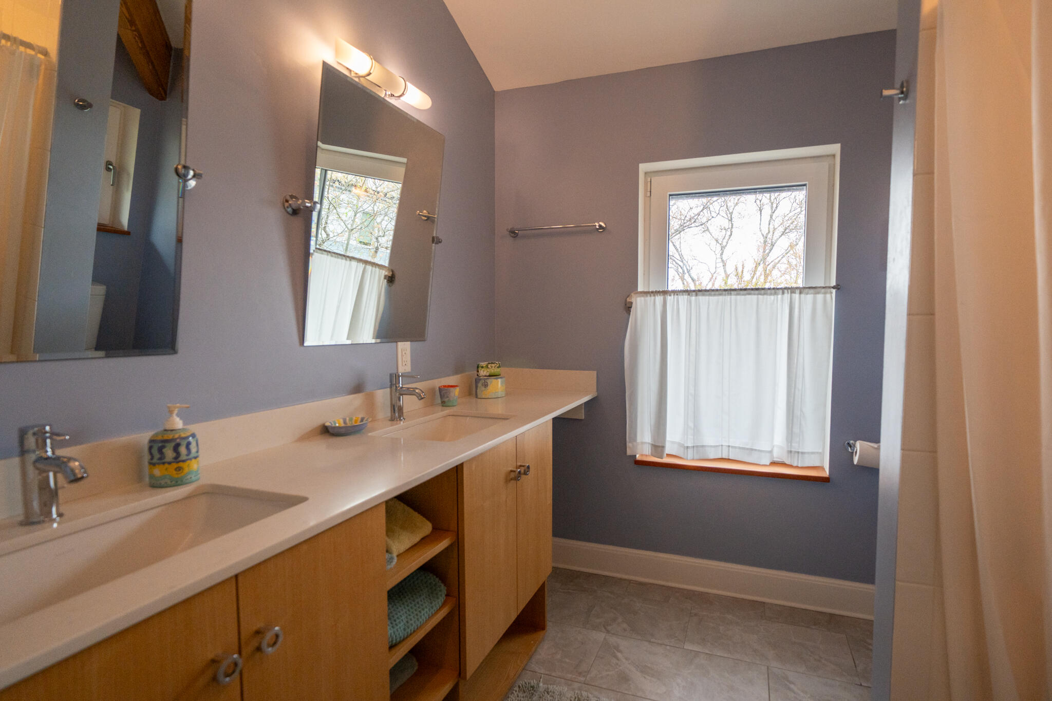 39 Sengekontacket Road Oak Bluffs, MA 02557 - Photo 20 of 32 a bathroom with a sink double vanity and a window