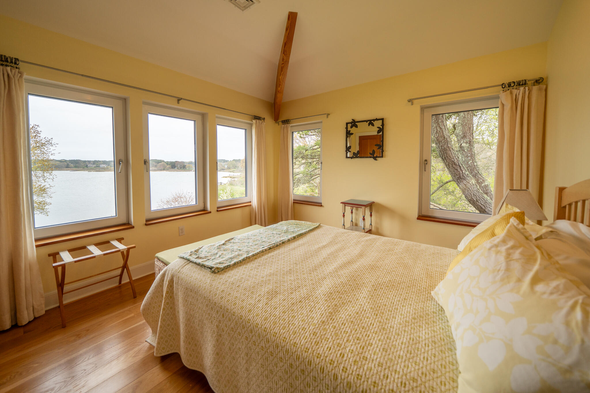 39 Sengekontacket Road Oak Bluffs, MA 02557 - Photo 23 of 32 a bedroom with a bed and wooden floor