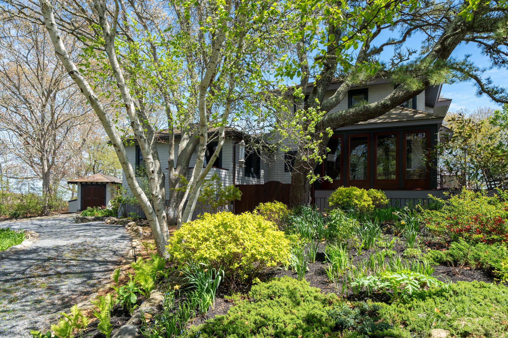 39 Sengekontacket Road Oak Bluffs, MA 02557 - Photo 4 of 32 a view of a garden with pathway