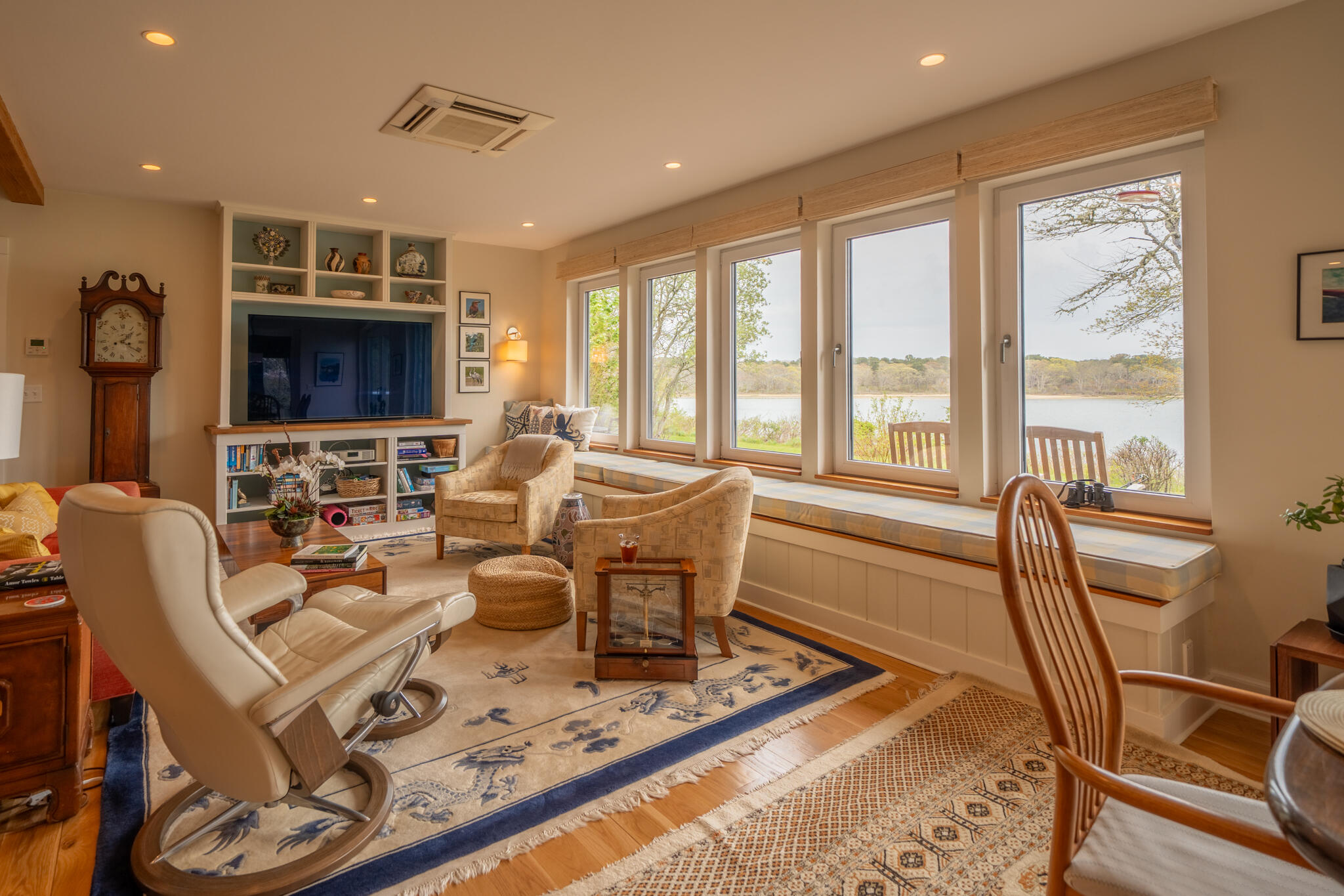 39 Sengekontacket Road Oak Bluffs, MA 02557 - Photo 8 of 32 a living room with furniture a flat screen tv and a large window