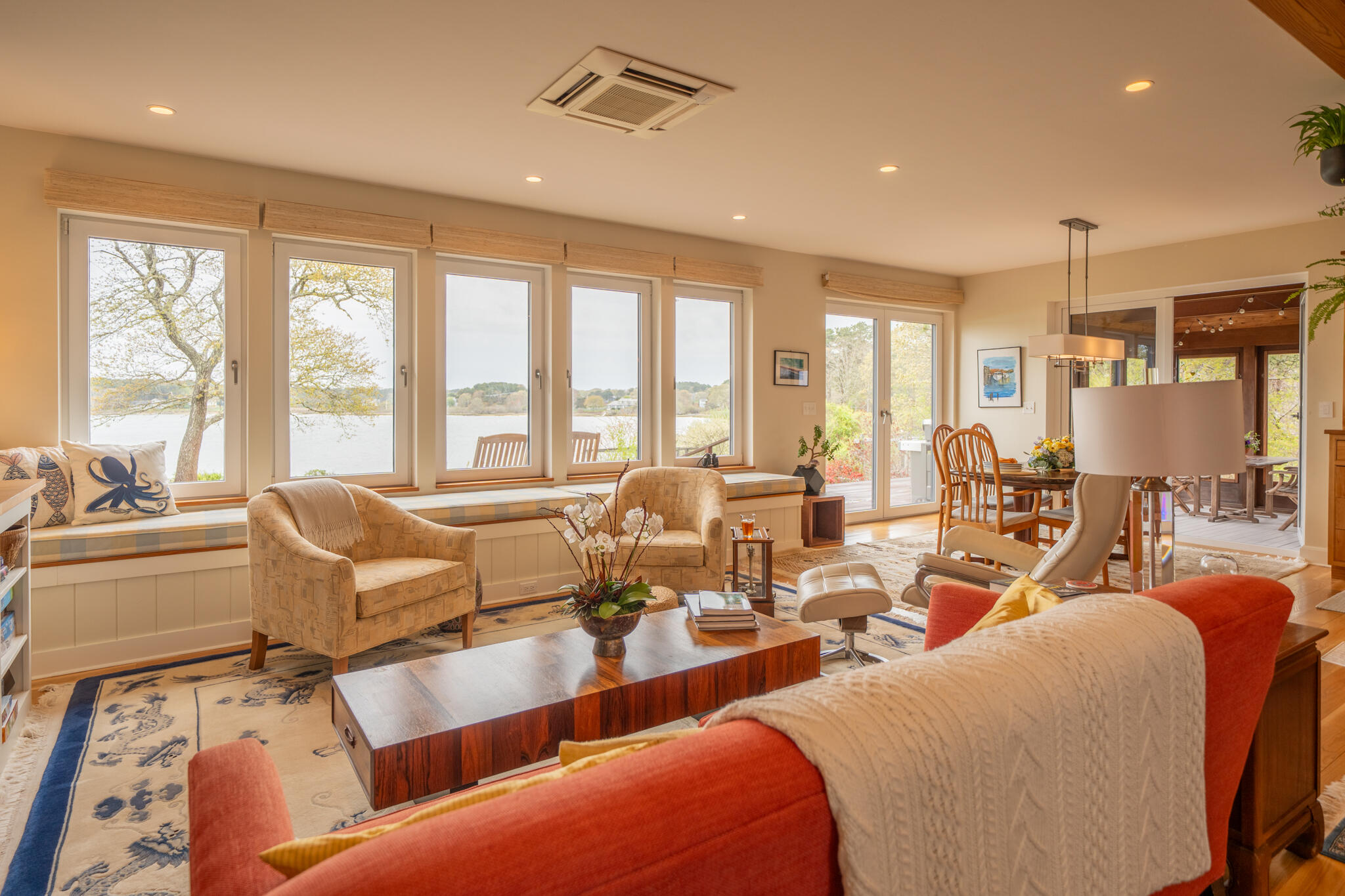 39 Sengekontacket Road Oak Bluffs, MA 02557 - Photo 9 of 32 a living room with furniture large windows and view view