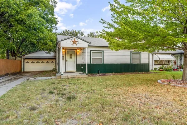 a house with trees in the background