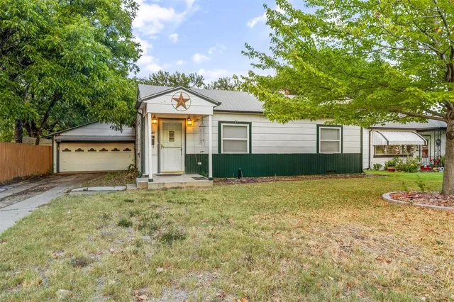 a house with trees in the background