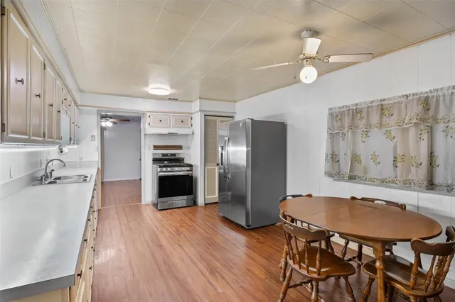 a spacious bathroom with a tub a sink and a shower