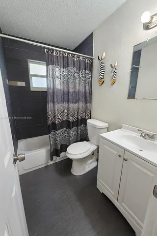 a bathroom with a toilet a sink and a bathtub