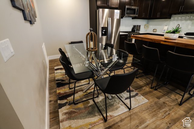 2331 Mesa Road, Unit E3 Moab, UT 84532 - Photo 12 of 71 Dining space with dark wood-style flooring and baseboards