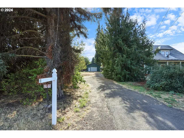 a backyard of a house with lots of green space