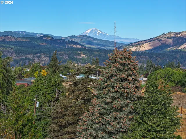 a view of a street with a building in the background