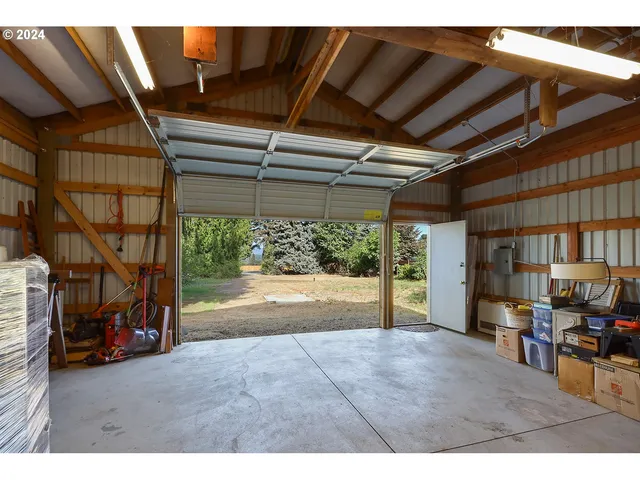 a view of a porch with furniture and a garage