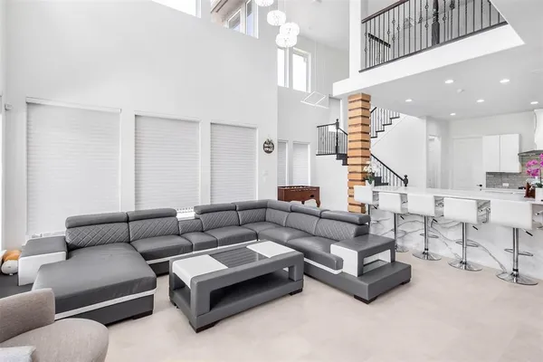 a kitchen with stainless steel appliances kitchen island granite countertop a sink a stove and cabinets