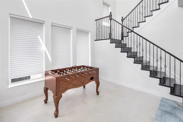 a kitchen with stainless steel appliances kitchen island granite countertop a refrigerator and a stove top oven