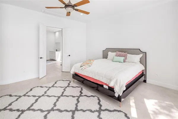 a bathroom with a sink a toilet a glass door shower and a mirror