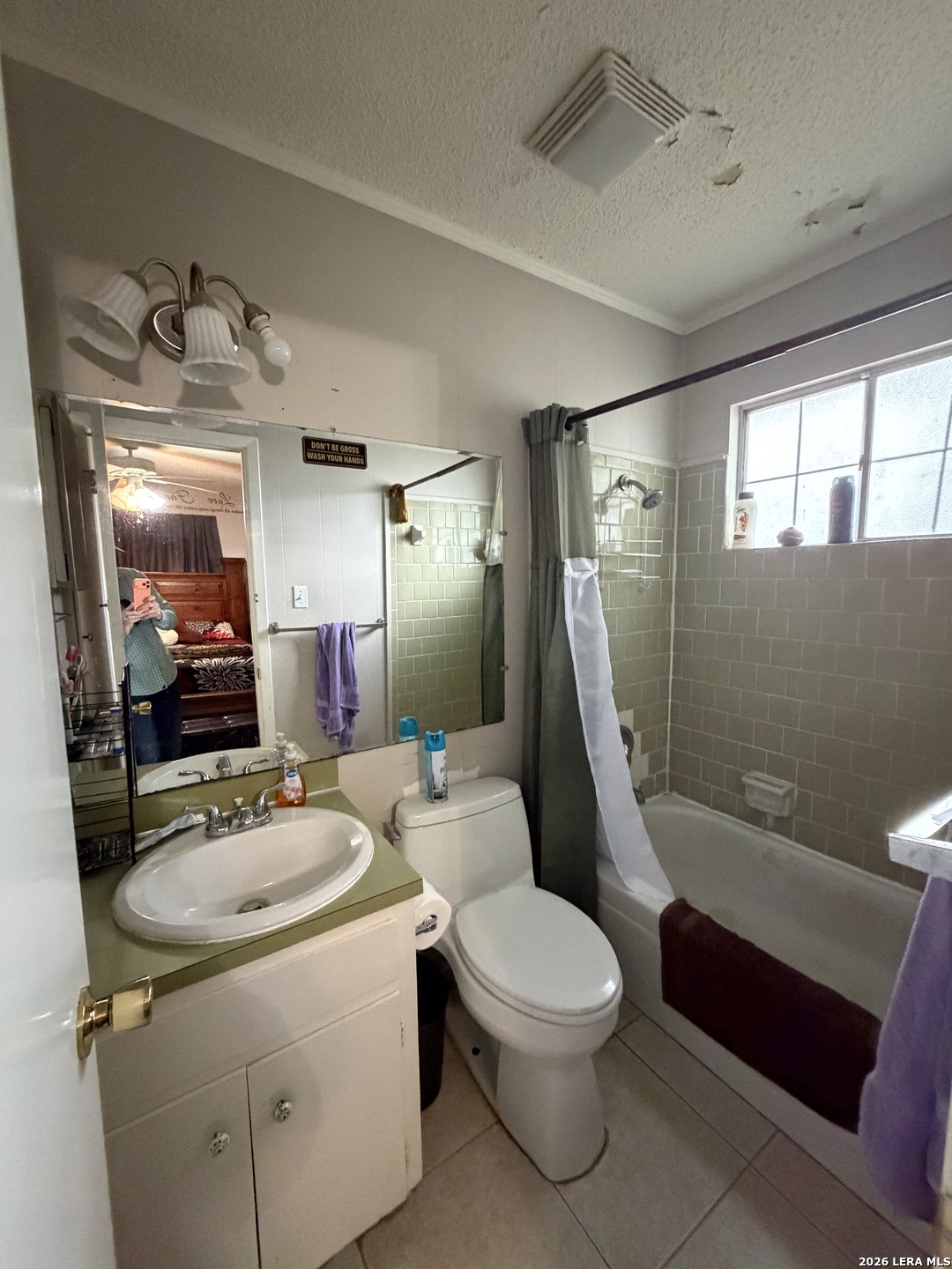 5014 Binz-Engleman Road San Antonio, TX 78219 - Photo 12 of 21 a bathroom with a sink a toilet and shower