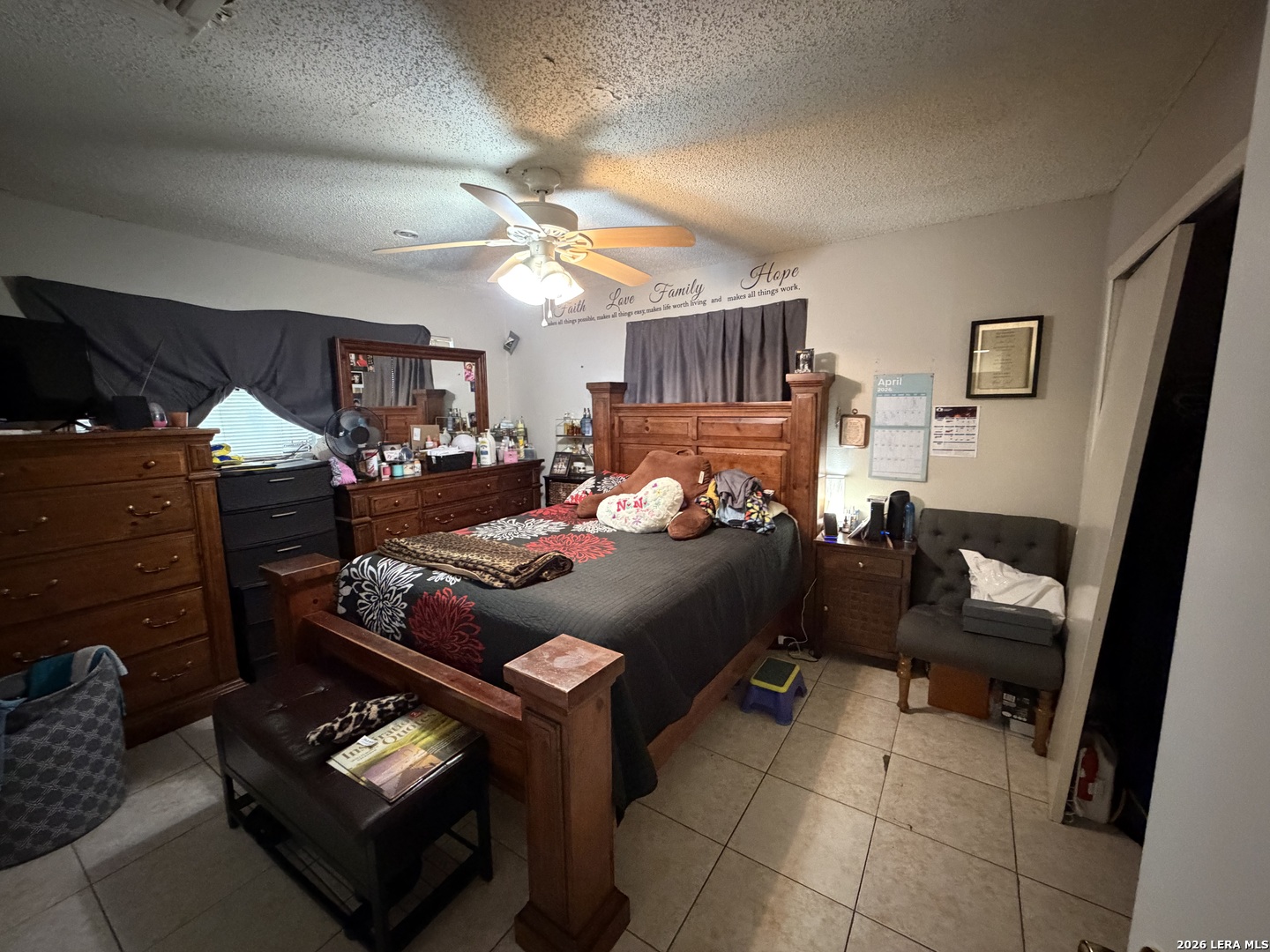 5014 Binz-Engleman Road San Antonio, TX 78219 - Photo 13 of 21 a bedroom with furniture and a fireplace