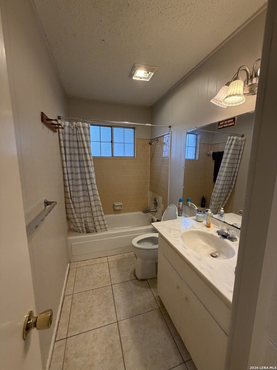 5014 Binz-Engleman Road San Antonio, TX 78219 - Photo 16 of 21 a bathroom with a sink a toilet and mirror