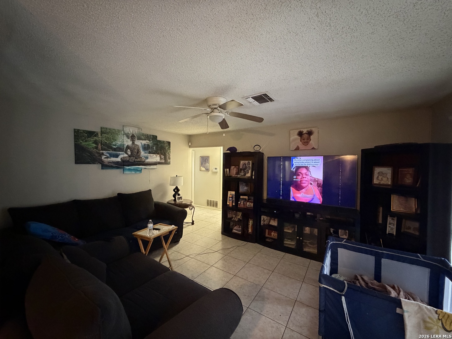5014 Binz-Engleman Road San Antonio, TX 78219 - Photo 4 of 21 a living room with furniture and a flat screen tv
