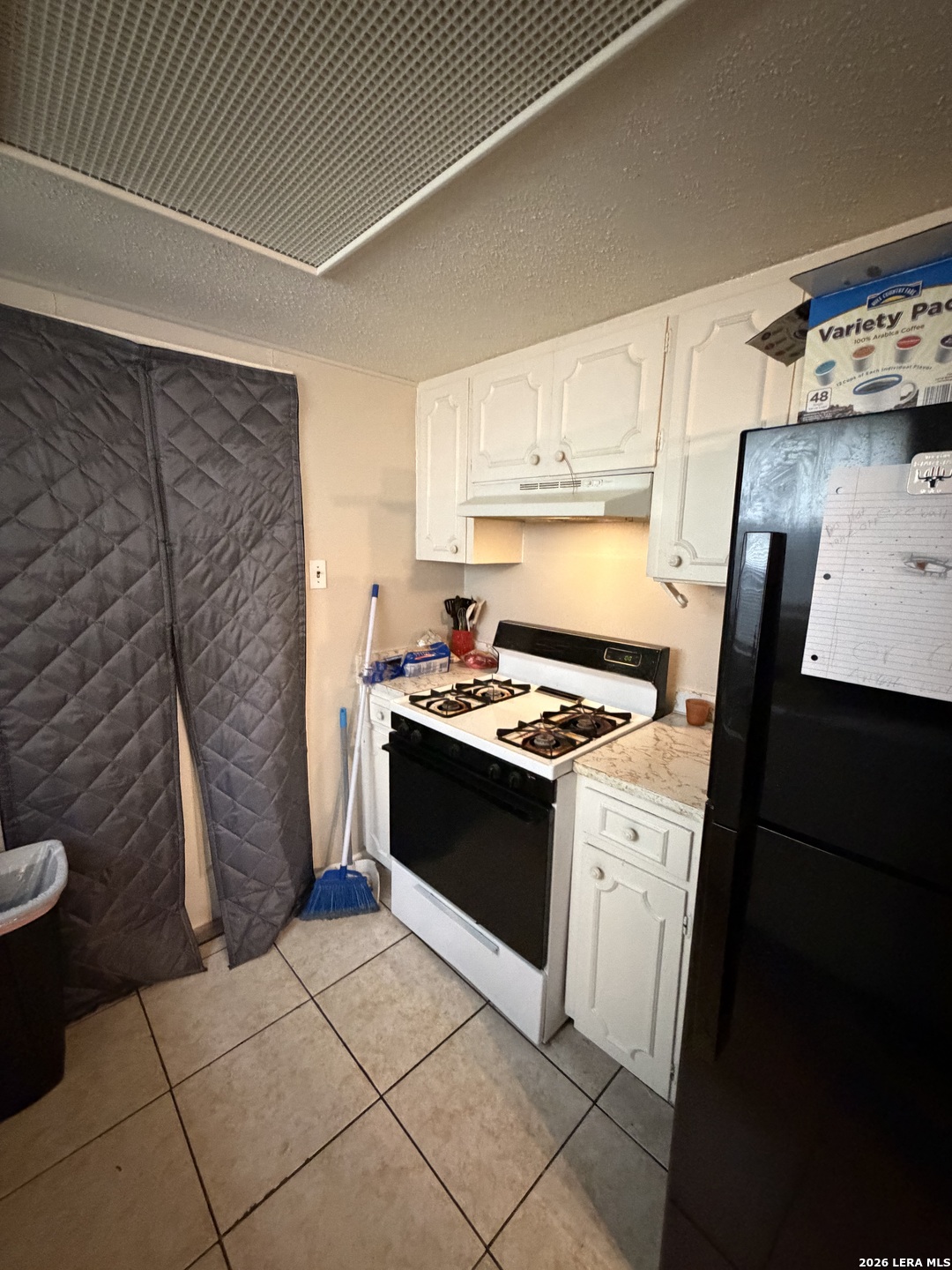 5014 Binz-Engleman Road San Antonio, TX 78219 - Photo 7 of 21 a kitchen with a stove and a refrigerator