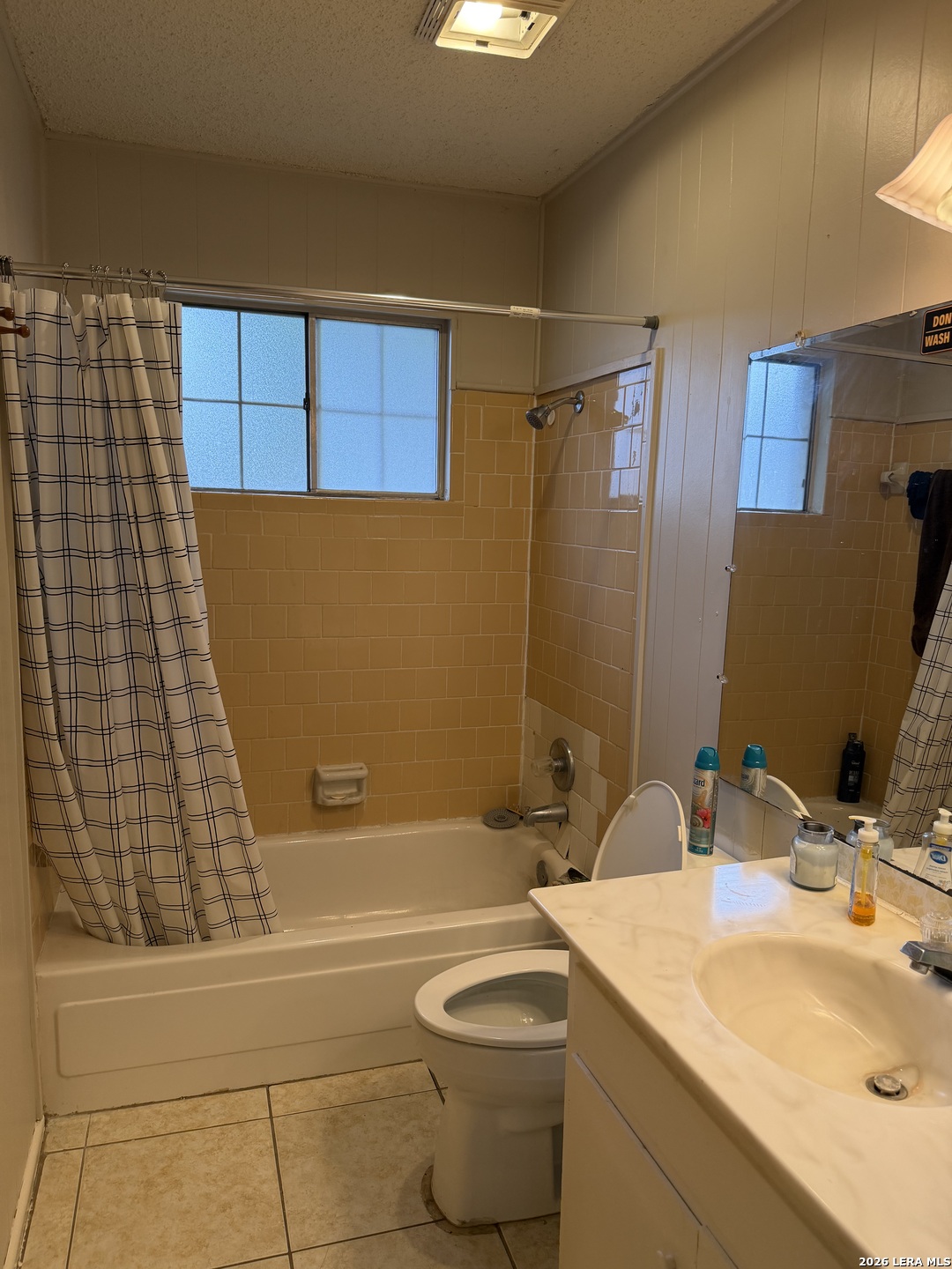 5014 Binz-Engleman Road San Antonio, TX 78219 - Photo 10 of 21 a bathroom with a granite countertop sink toilet and shower
