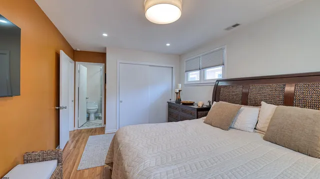 a bedroom with a bed and window