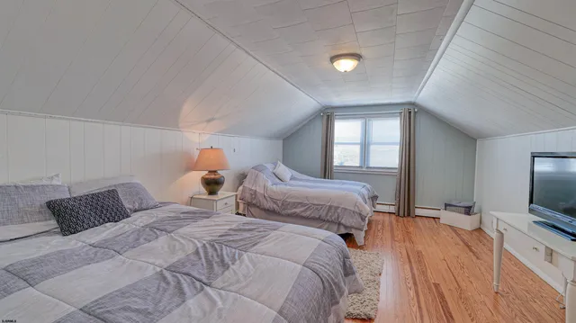 a bedroom with a bed and tv