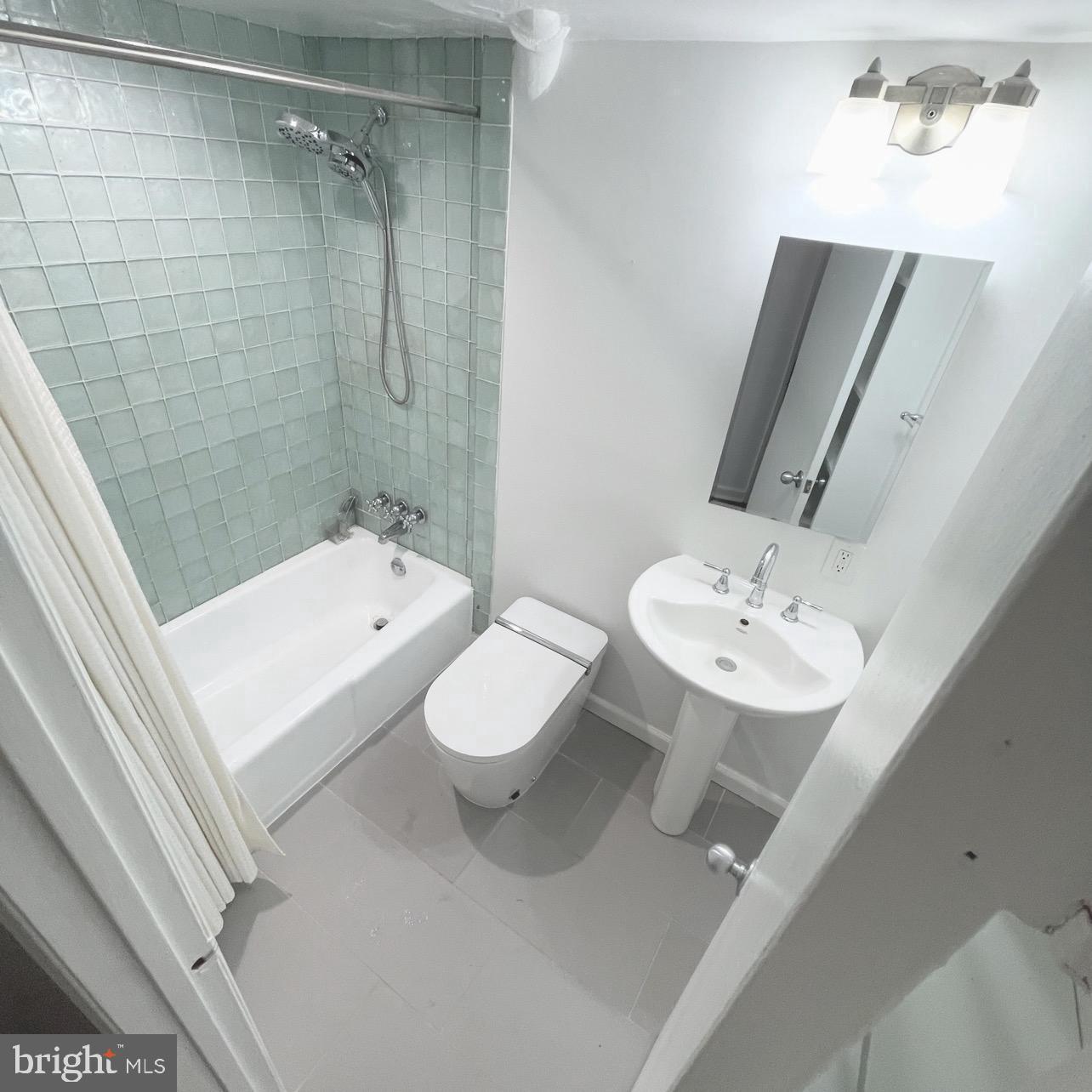 1525 Q Street Northwest, Unit 2 Washington, DC 20009 - Photo 10 of 20 Bathroom with Tile Bath and Luxurious Bidet Toilet