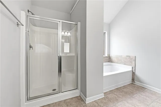 a bathroom with a bathtub and a sink