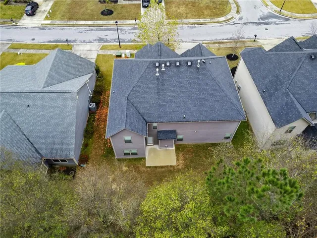 a aerial view of a house with swimming pool